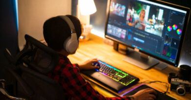 Professional Videographer Works on Desktop Computer